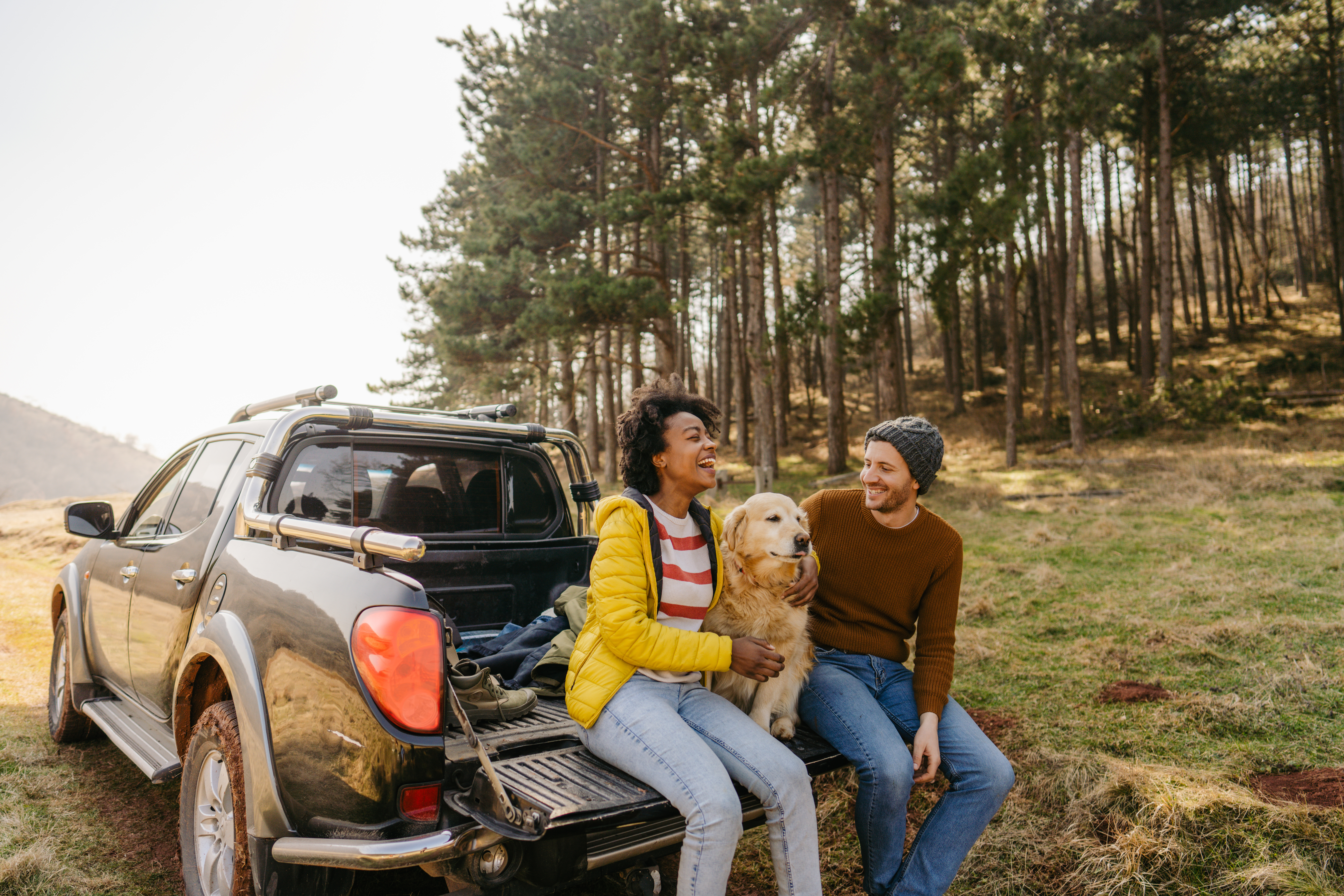 Couple on a spring road trip with their dog