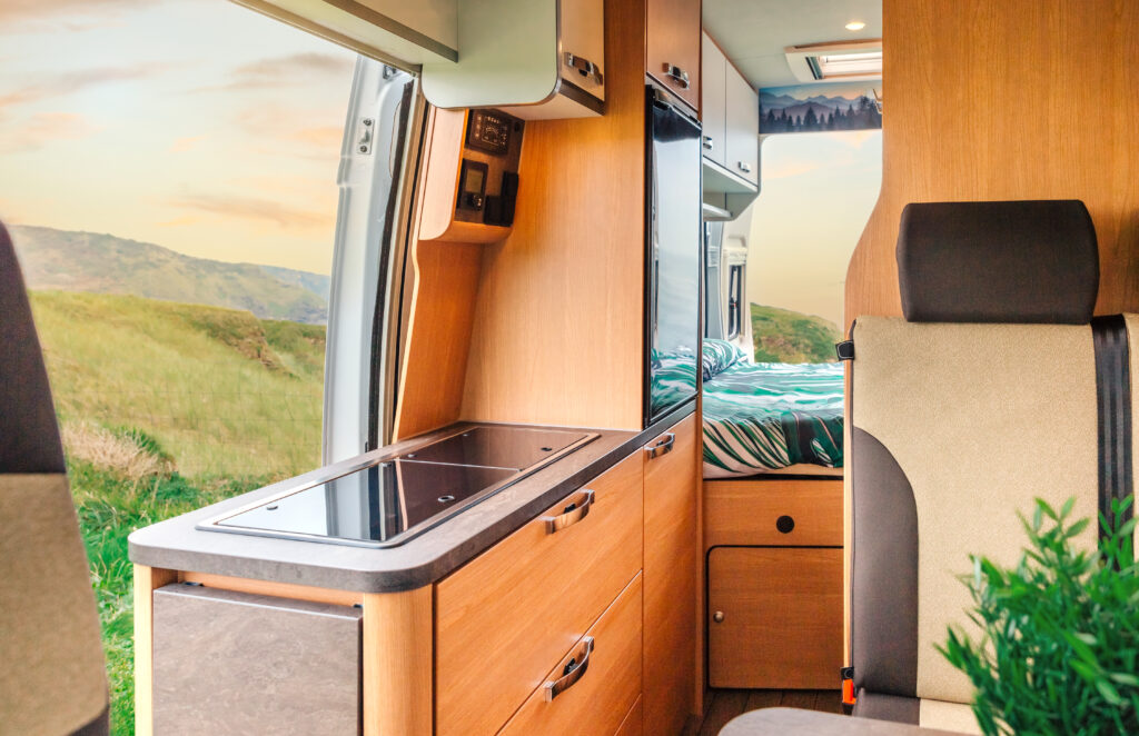 Interior of a caravan van with kitchen and bed